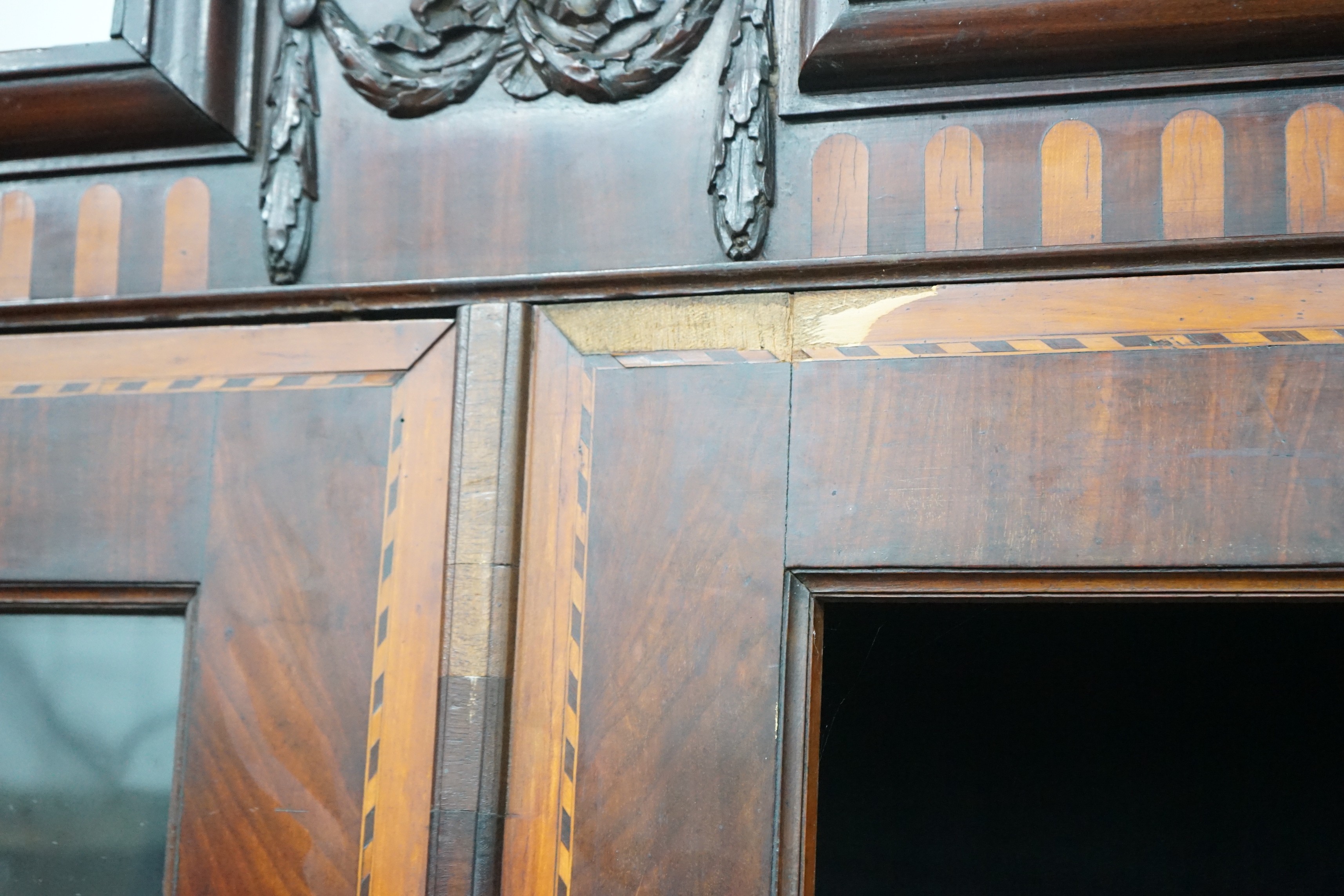 An 18th century Dutch walnut and fruitwood vitrine, with two glazed doors, width 148cm, depth 35cm, height 202cm